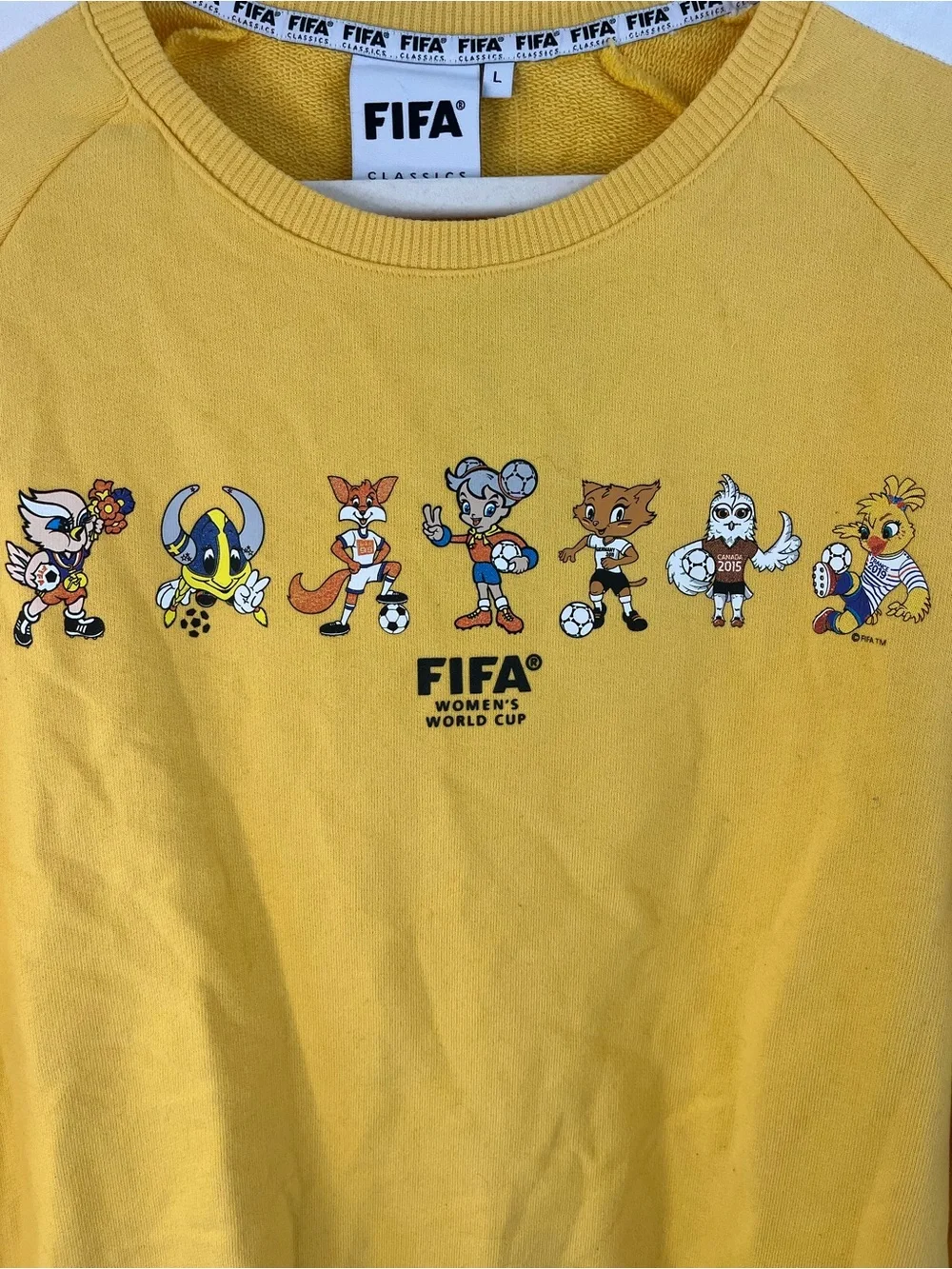 Rare NWT FIFA Classics Women’s World Cup Mascot Crewneck Sweatshirt Yellow Sz L